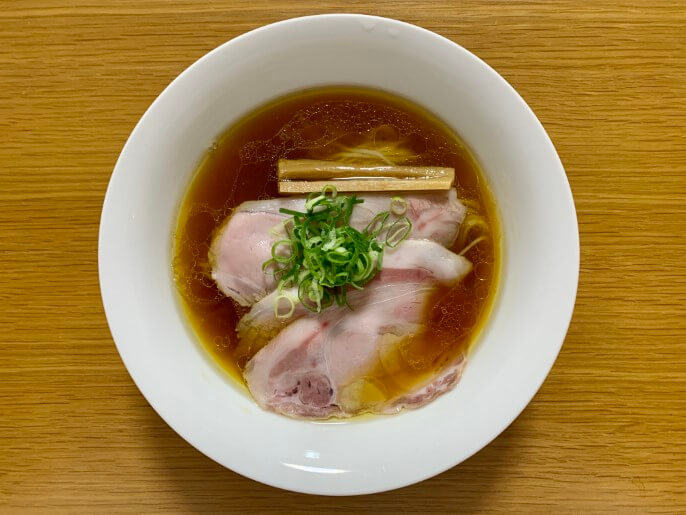 Tokyo‑style shoyu ramen: clear soy‑based broth, thin straight noodles, topped with chashu