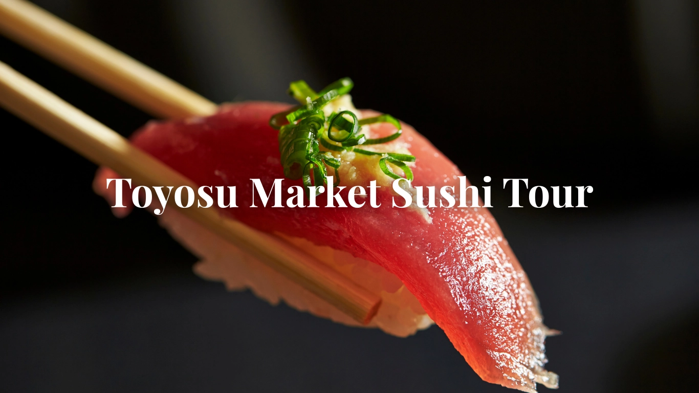 Close-up of a hand holding a piece of fresh tuna nigiri sushi with chopsticks, Toyosu Market style